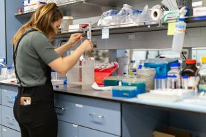 Scientist working in a laboratory setting.